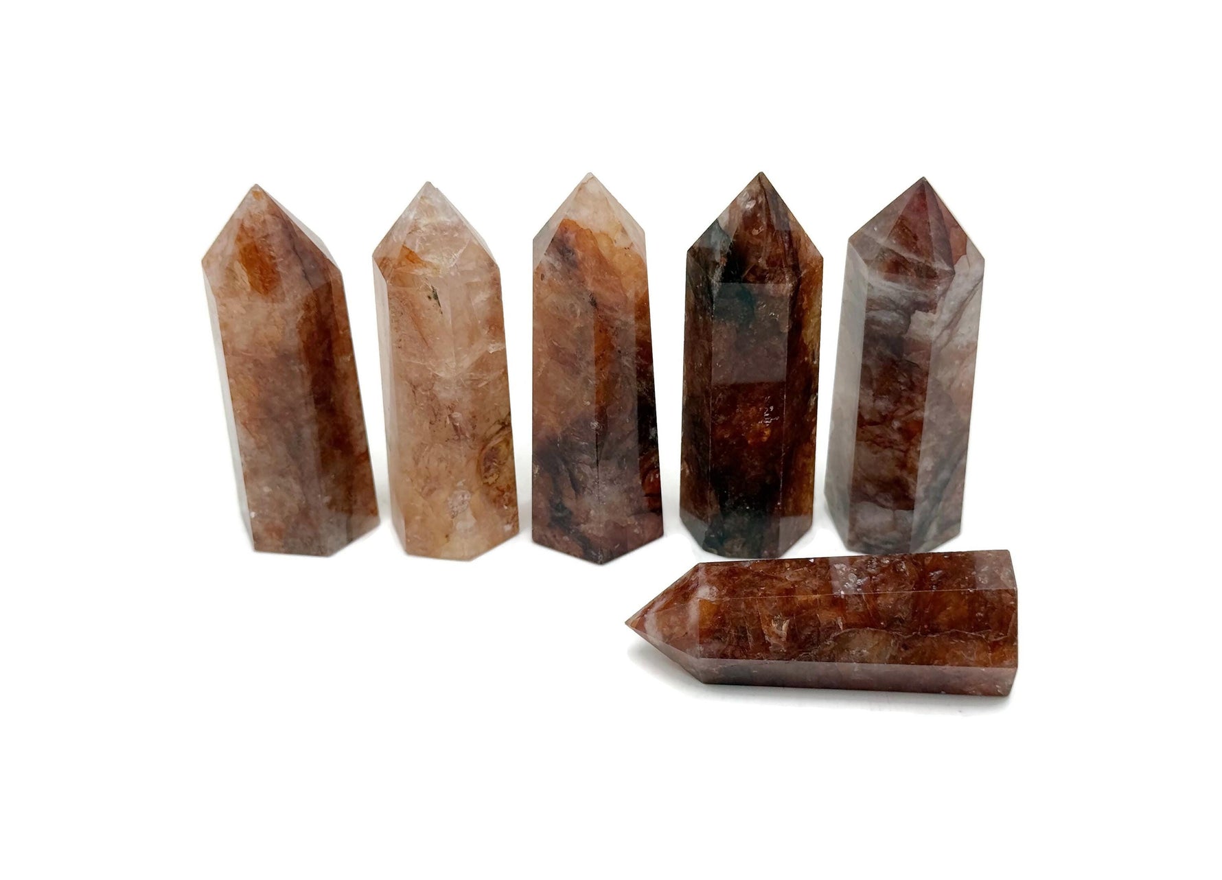 Red Hematoid Quartz Fire Quartz obelisk tower crystal from GemstoneGO, showcasing a vibrant red and clear stone with natural crystal formations.