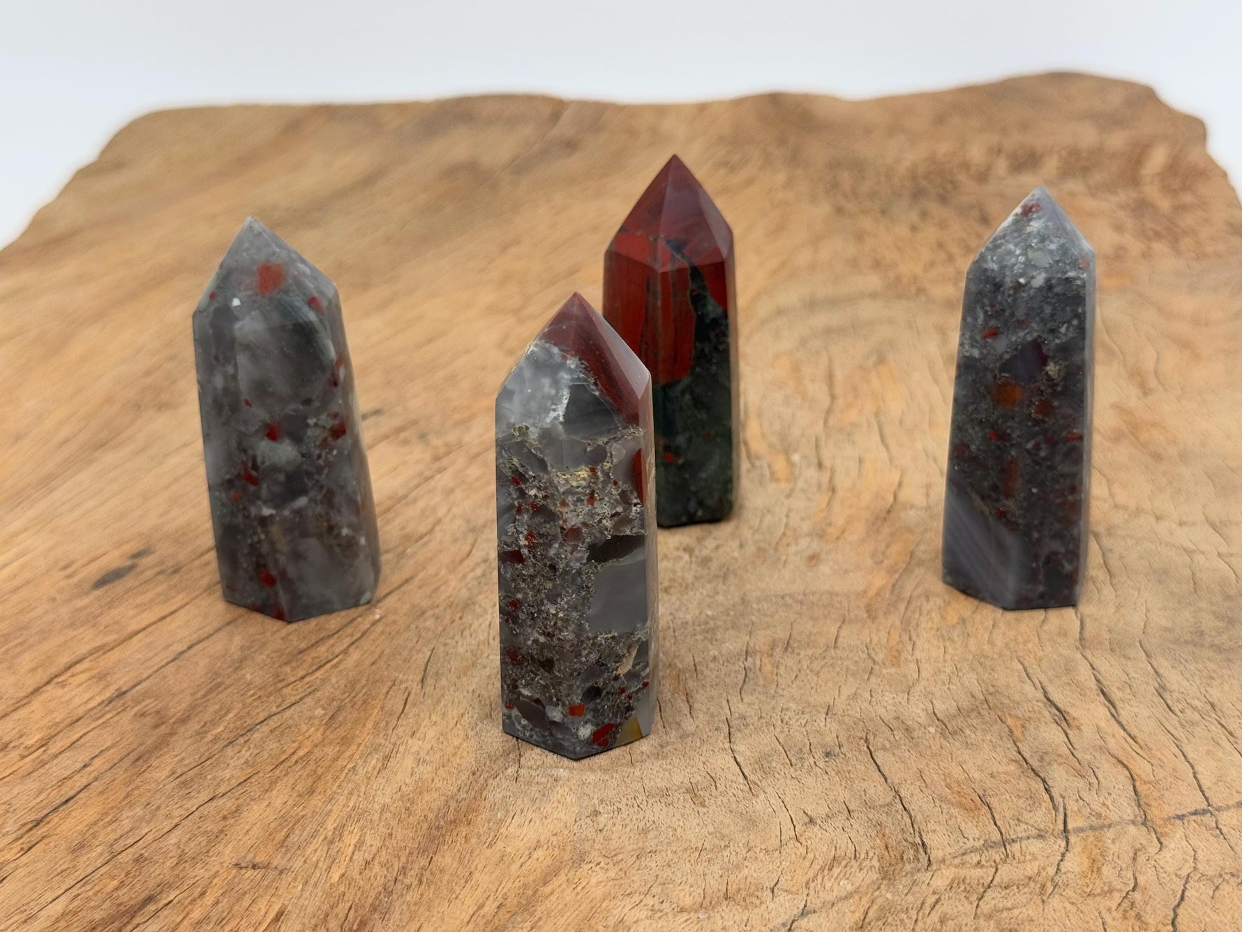 African Bloodstone obelisk tower crystal by GemstoneGO, showcasing a dark green stone with red bloodstone inclusions.
