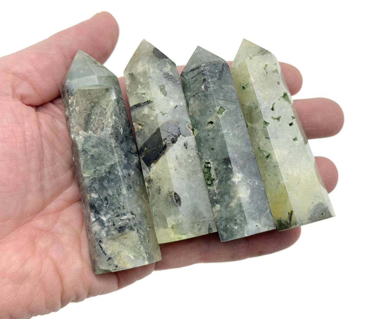 Prehnite obelisk tower crystal by GemstoneGO, showcasing a green gemstone with smooth polished surfaces and natural mineral patterns.