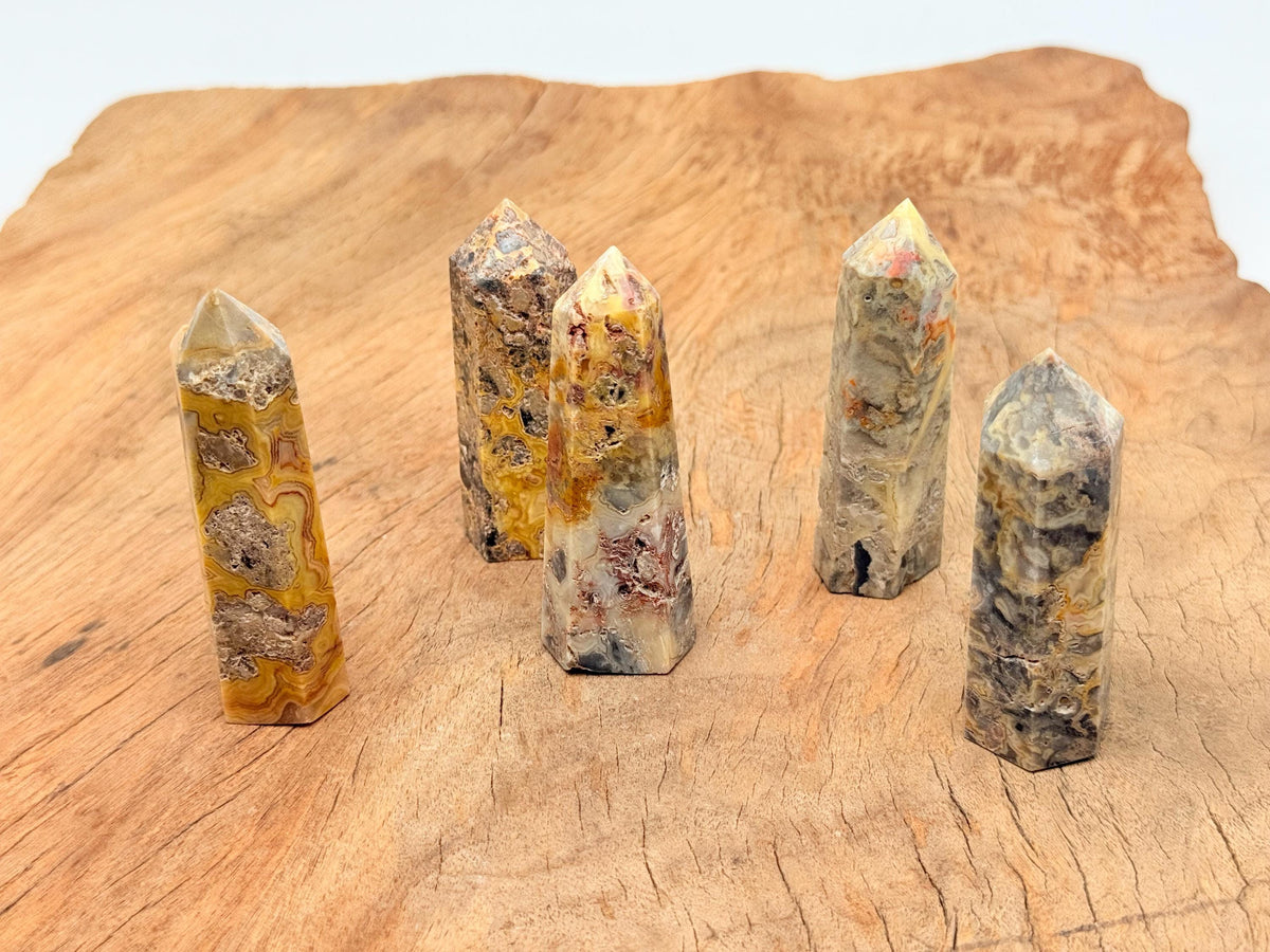 Crazy Lace Agate obelisk tower crystal from GemstoneGO, showcasing vibrant patterns and polished surface for decorative use.