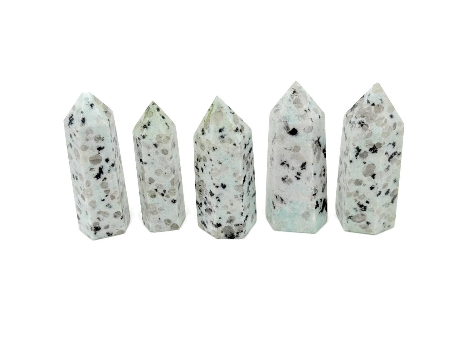 Kiwi Jasper obelisk tower crystal from GemstoneGO with green and brown natural stone patterns on a white background