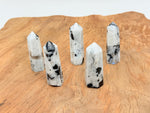 Rainbow moonstone obelisk tower crystal from GemstoneGO, showcasing a polished, luminous gemstone with natural rainbow shimmer.