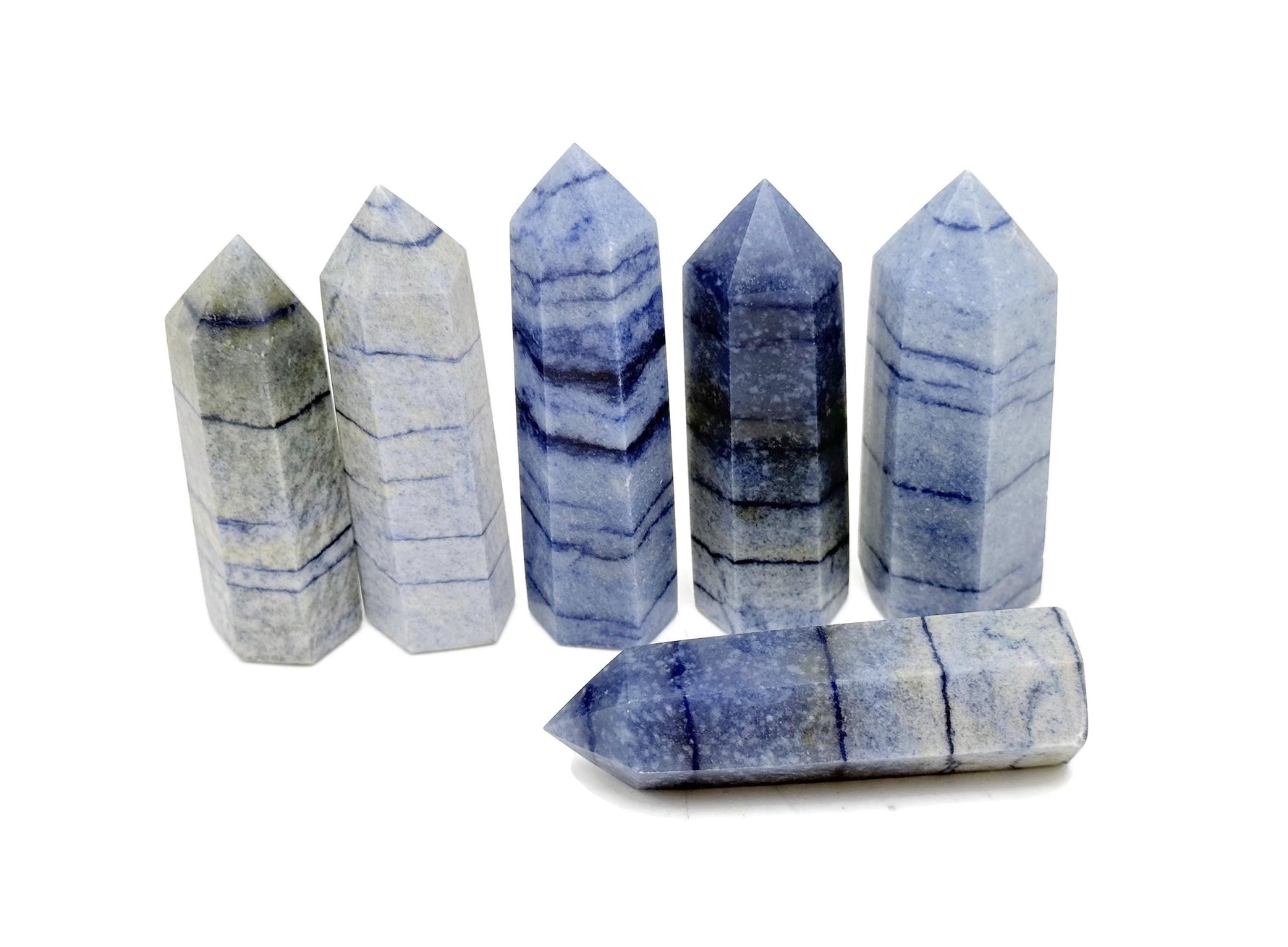Blue aventurine obelisk tower crystal from GemstoneGO, showcasing a polished blue gemstone obelisk with natural stone striations.