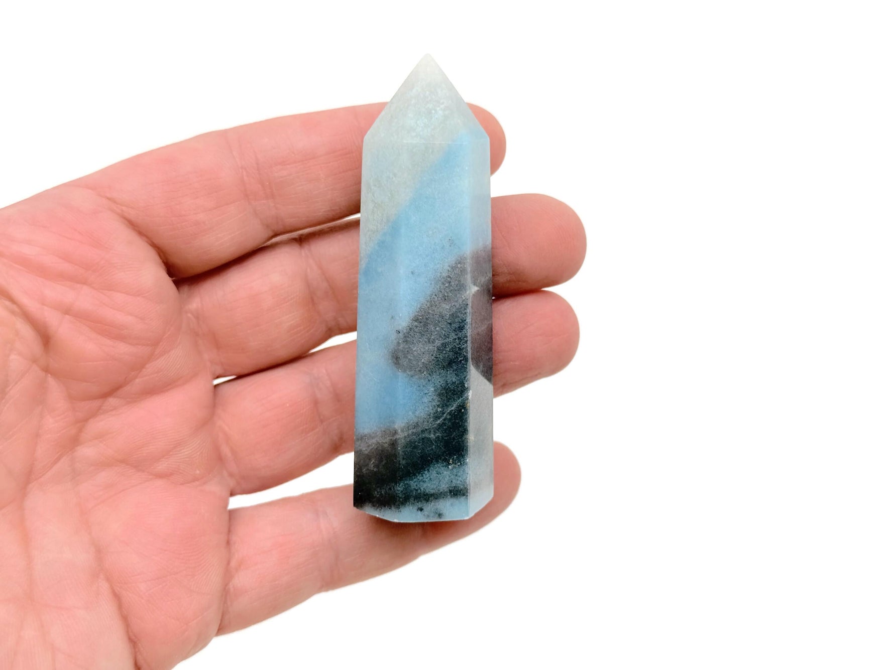 Trolleite obelisk tower crystal from GemstoneGO, showcasing a deep blue mineral with natural crystal formations and smooth polished surfaces.
