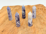 Purple Lavender Lace Agate obelisk tower crystal by GemstoneGO, showcasing a smooth, polished lavender and purple stone with natural patterns.