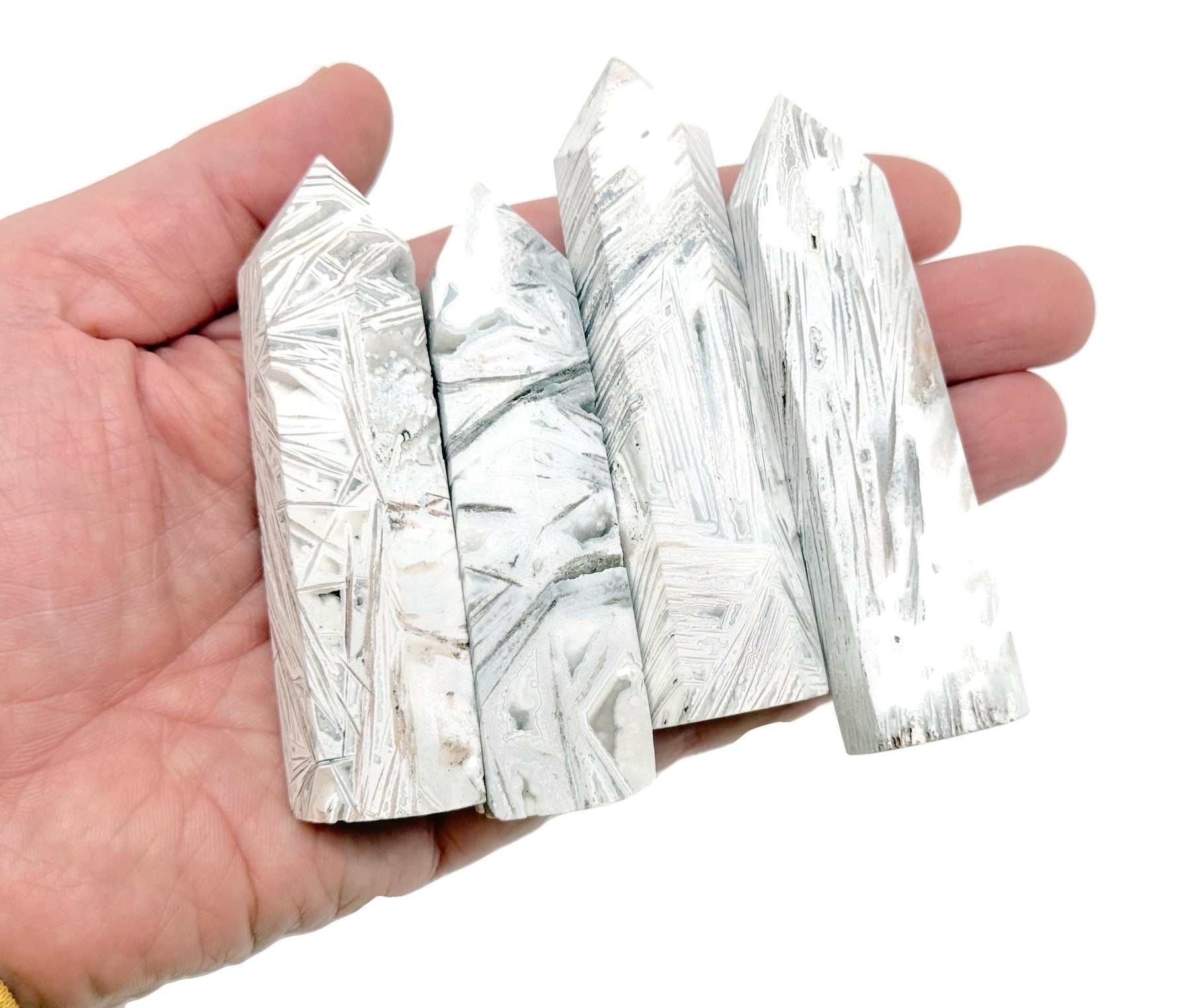 Mexican White Agate obelisk tower crystal by GemstoneGO, featuring smooth polished surface and natural stone patterns.