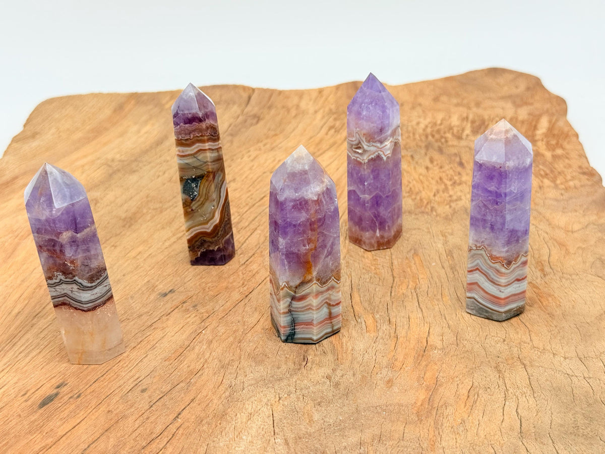 Amethyst Crazy Lace Agate obelisk tower crystal from GemstoneGO, showcasing vibrant purple and intricate banding details.