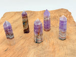 Amethyst Crazy Lace Agate obelisk tower crystal from GemstoneGO, showcasing vibrant purple and intricate banding details.