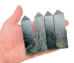 Emerald quartz obelisk tower crystal from GemstoneGO, showcasing a vibrant green gemstone with a polished, pointed crystal design.
