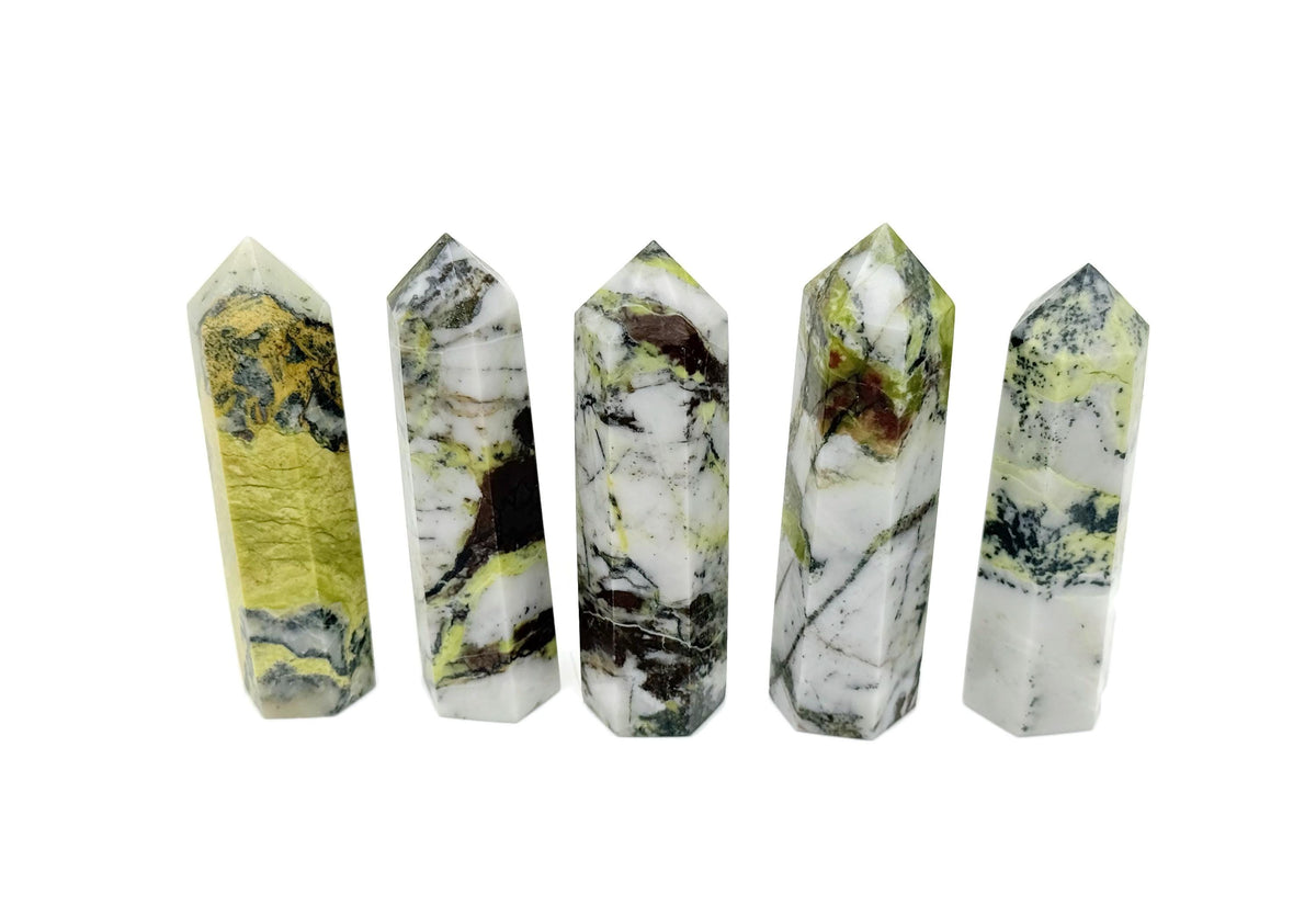 Yellow turquoise obelisk tower crystal from GemstoneGO, featuring a polished yellow turquoise gemstone carved into a tall obelisk shape.