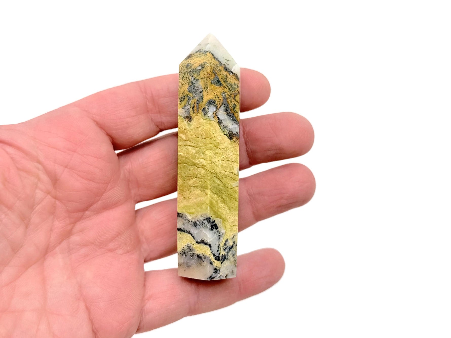 Yellow turquoise obelisk tower crystal from GemstoneGO, featuring a polished yellow turquoise gemstone carved into a tall, tapered obelisk shape.