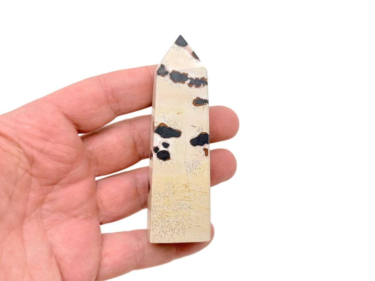 Picture Jasper obelisk tower crystal from GemstoneGO showing a natural stone with earthy tones and unique banding patterns.