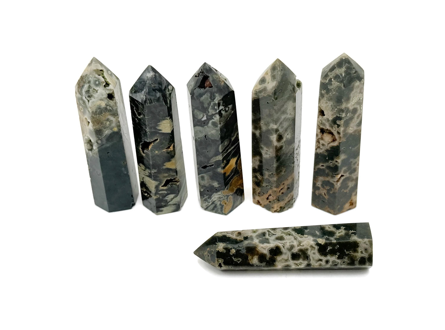 Ocean Jasper obelisk tower crystal from GemstoneGO, showcasing colorful, polished stone with natural patterns and a pointed tip.