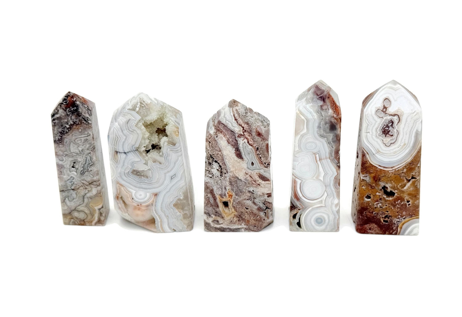Crazy Lace Agate obelisk tower crystal from GemstoneGO featuring colorful banded patterns and a polished pointed shape.