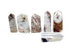 Crazy Lace Agate obelisk tower crystal from GemstoneGO, showcasing vibrant banded patterns and polished stone surface.