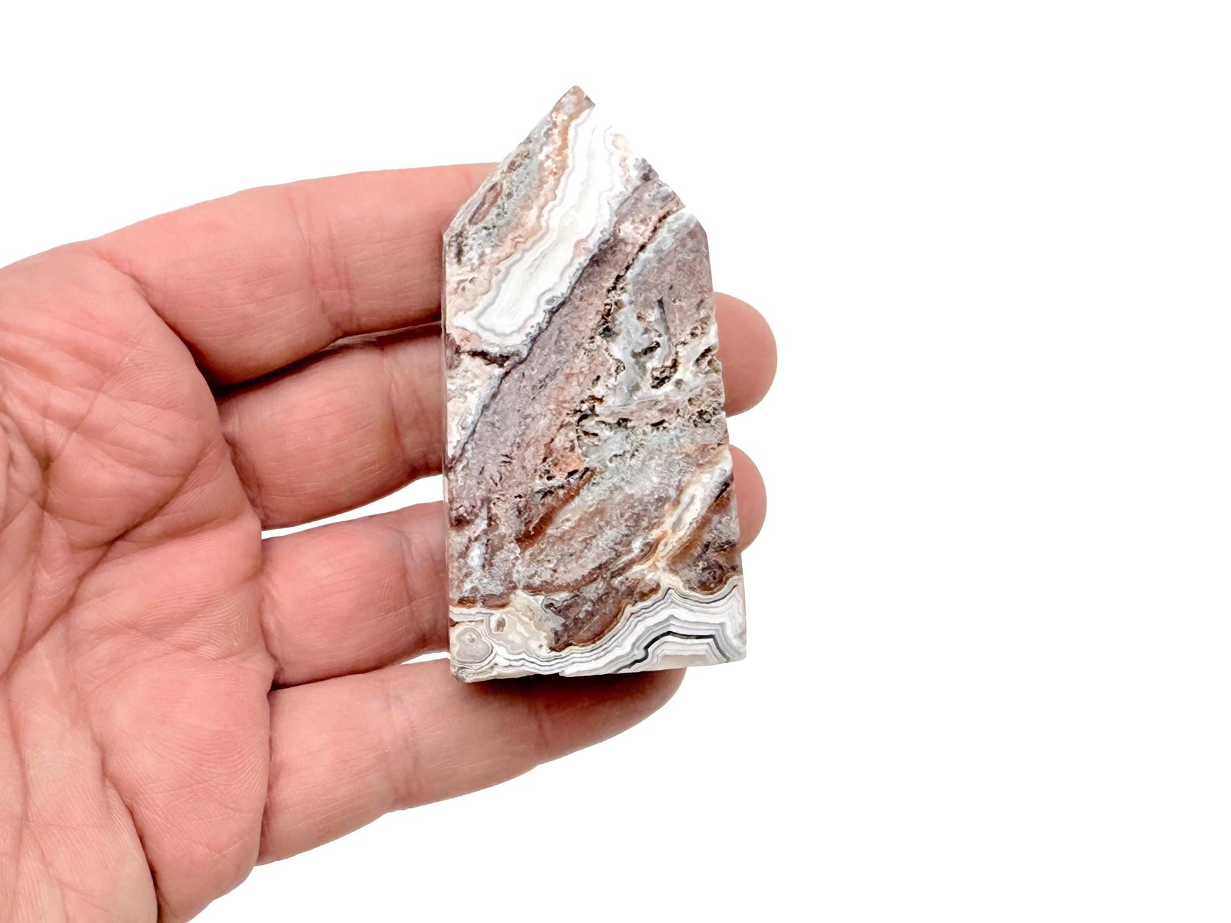 Crazy Lace Agate obelisk tower crystal from GemstoneGO, featuring vibrant, swirling patterns and a polished pointed shape.