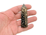 Leopard skin Jasper obelisk tower crystal from GemstoneGO, showcasing a tall, polished stone with distinctive spotted patterns.