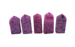 Red Corundum obelisk tower crystal from GemstoneGO, featuring a polished red gemstone obelisk with natural crystal clarity.