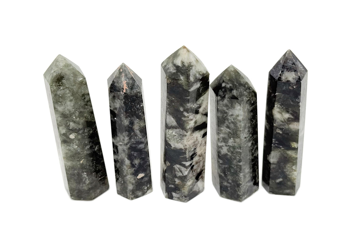 Green Lepidolite obelisk tower crystal from GemstoneGO with a polished, vibrant green and purple hue, showcasing its natural mineral structure.