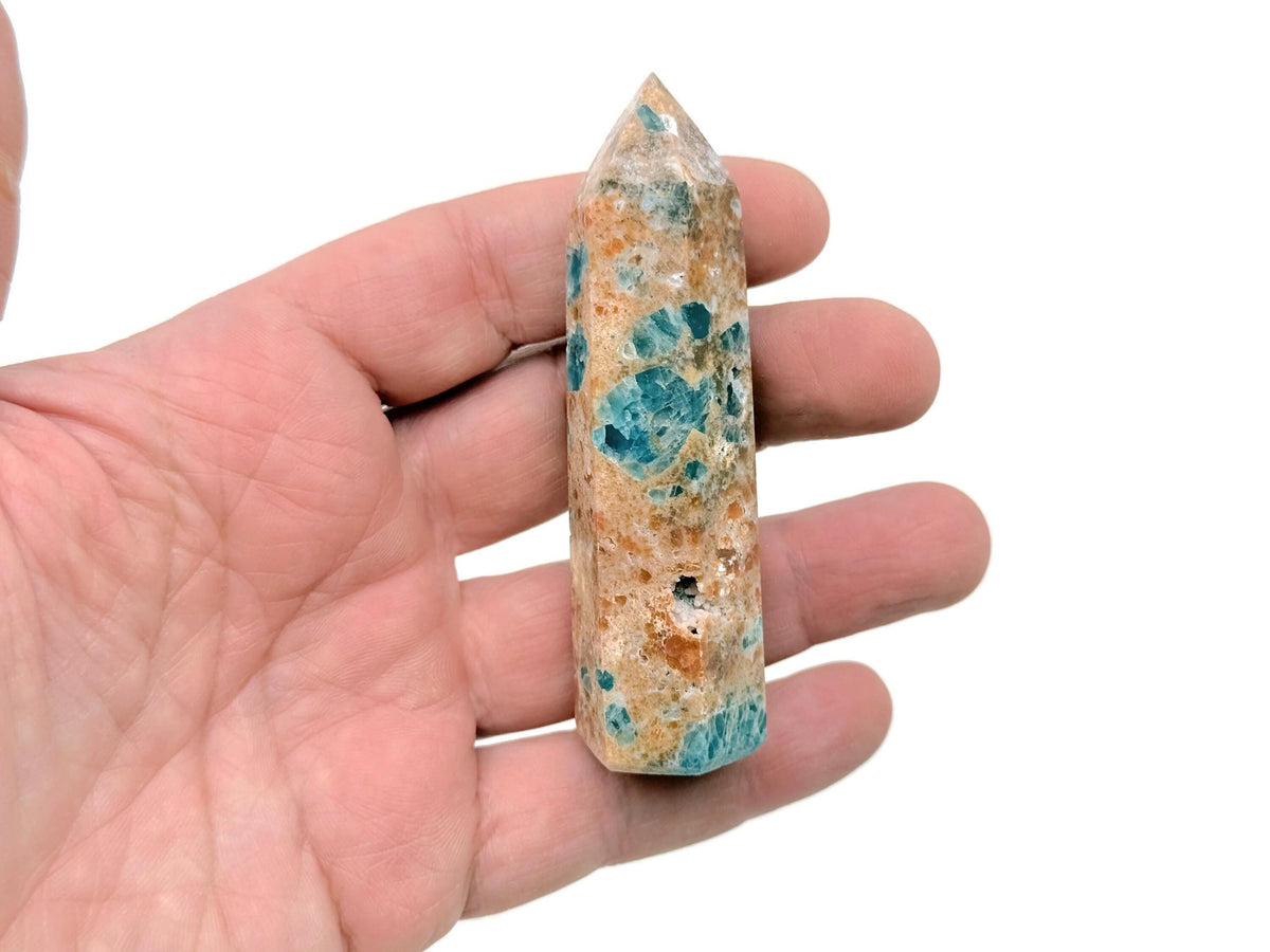Sunstone and Blue Apatite obelisk tower crystal from GemstoneGO, showcasing vibrant orange and blue mineral formations.