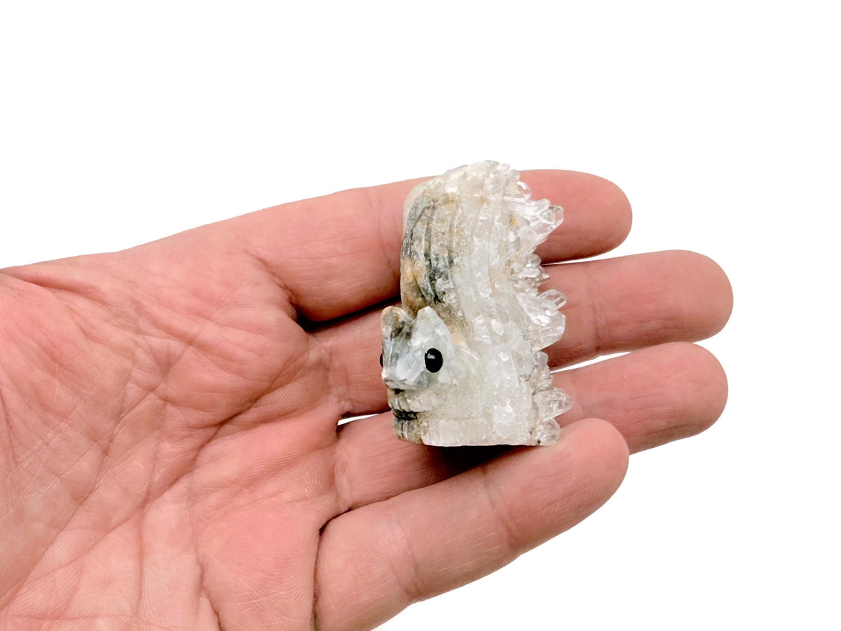 Squirrel-shaped quartz gemstone carving by GemstoneGO, detailed natural stone sculpture of a squirrel on a polished surface.