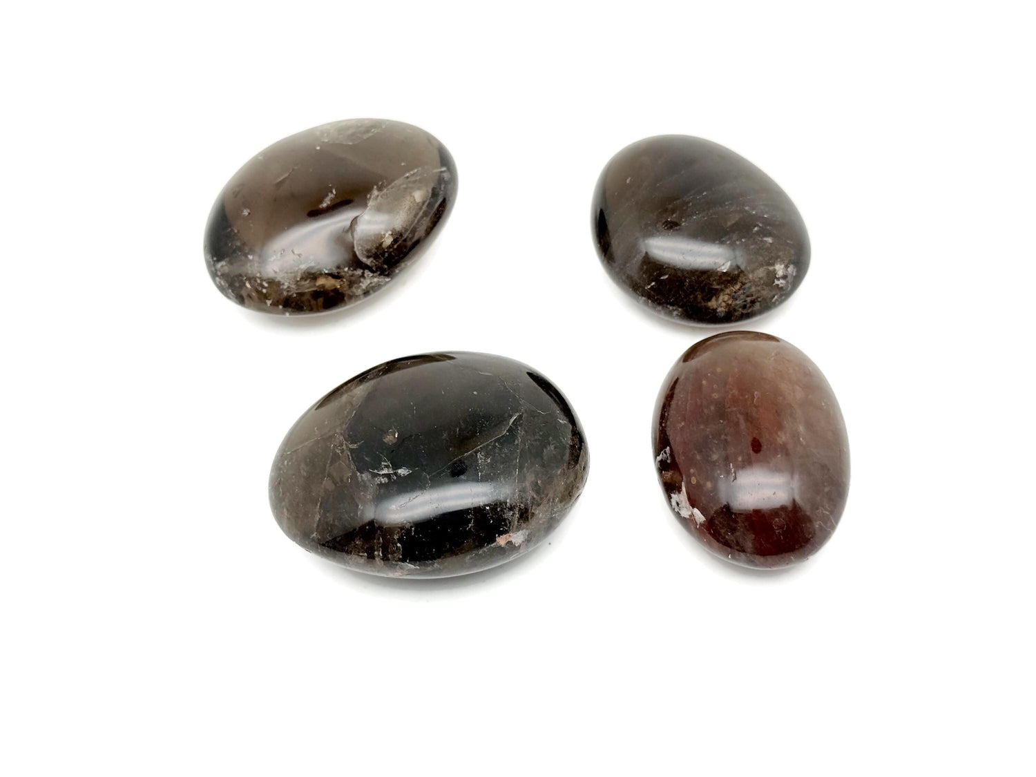 Smoky Quartz palm gemstone spa stone from GemstoneGO, showcasing a polished, natural smoky quartz gemstone for healing and relaxation.