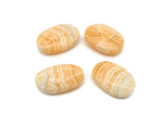 Yellow calcite palm gemstone spa stone from GemstoneGO, smooth yellow mineral with rounded shape for relaxation and healing.