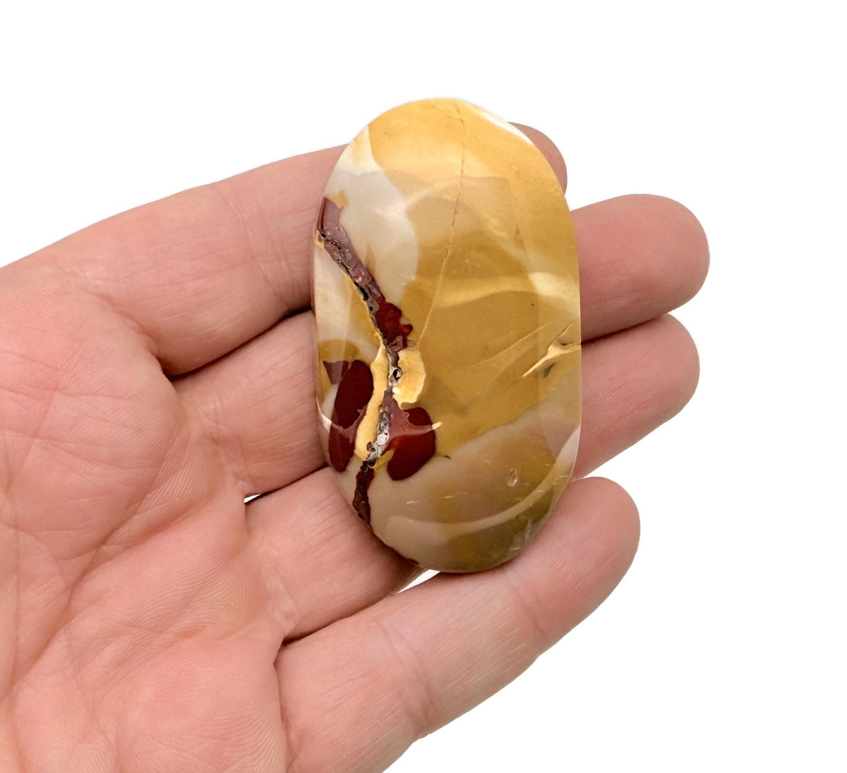 Mookaite Jasper palm gemstone spa stone from GemstoneGO, smooth polished stone for meditation and relaxation.