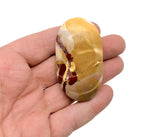 Mookaite Jasper palm gemstone spa stone from GemstoneGO, smooth polished stone for meditation and relaxation.