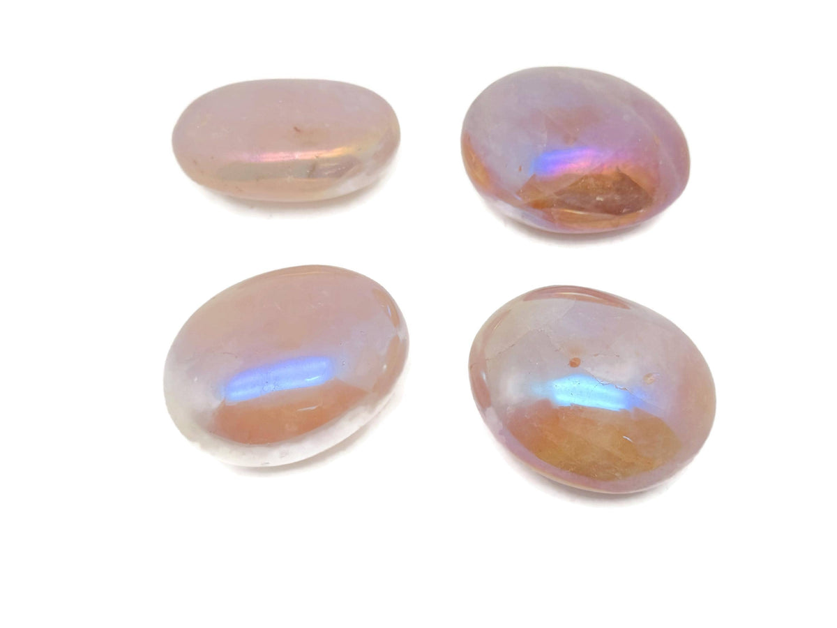Angel Aura Quartz palm gemstone spa stone from GemstoneGO, showcasing iridescent, polished quartz with a smooth, oval shape.