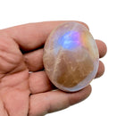 Angel Aura Quartz palm gemstone spa stone from GemstoneGO, showcasing a shimmering, iridescent aura finish on a smooth palm-sized stone.