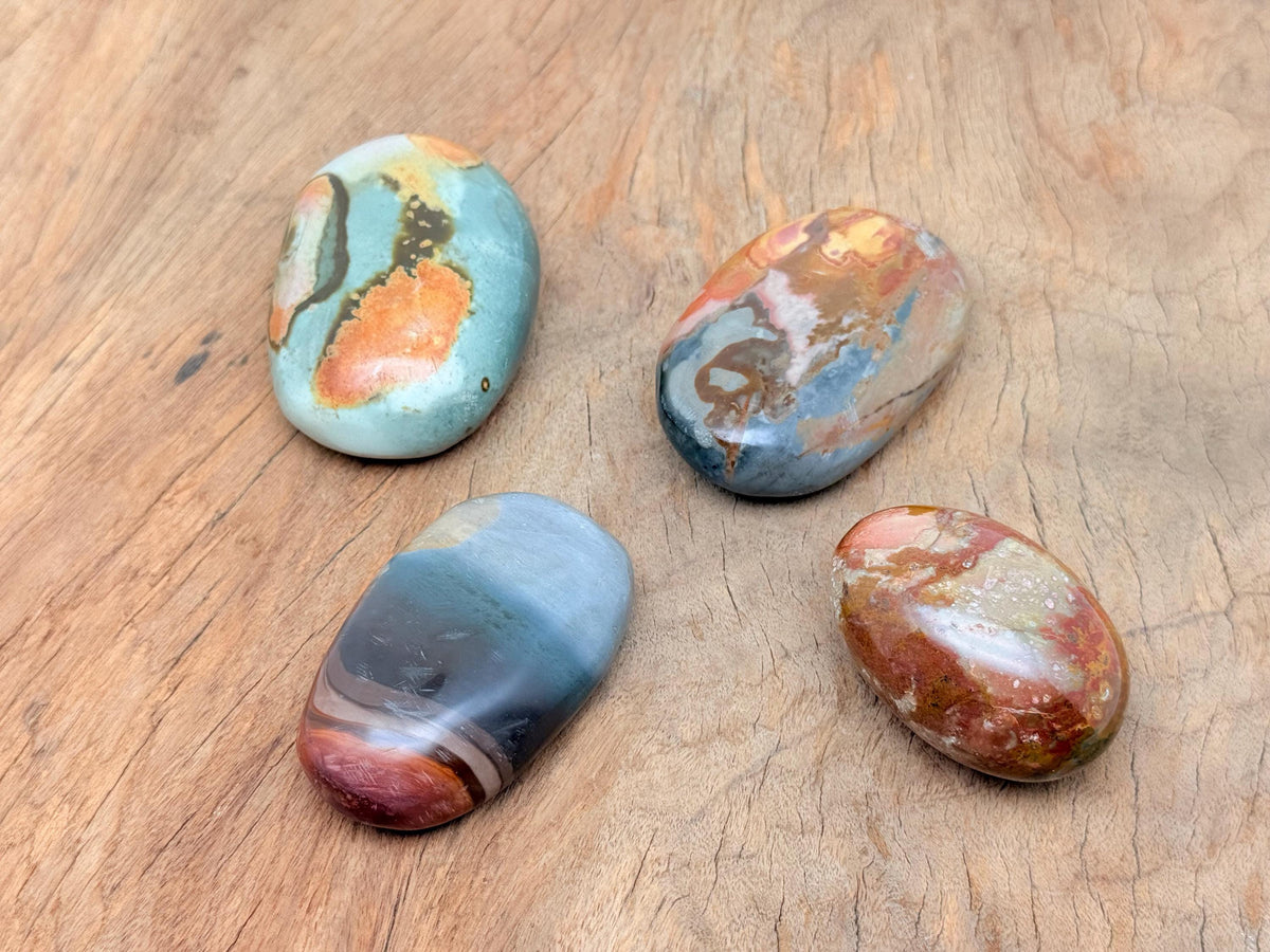 Ocean Jasper palm gemstone spa stone from GemstoneGO, showing a smooth, polished natural ocean-colored orb for healing and relaxation.