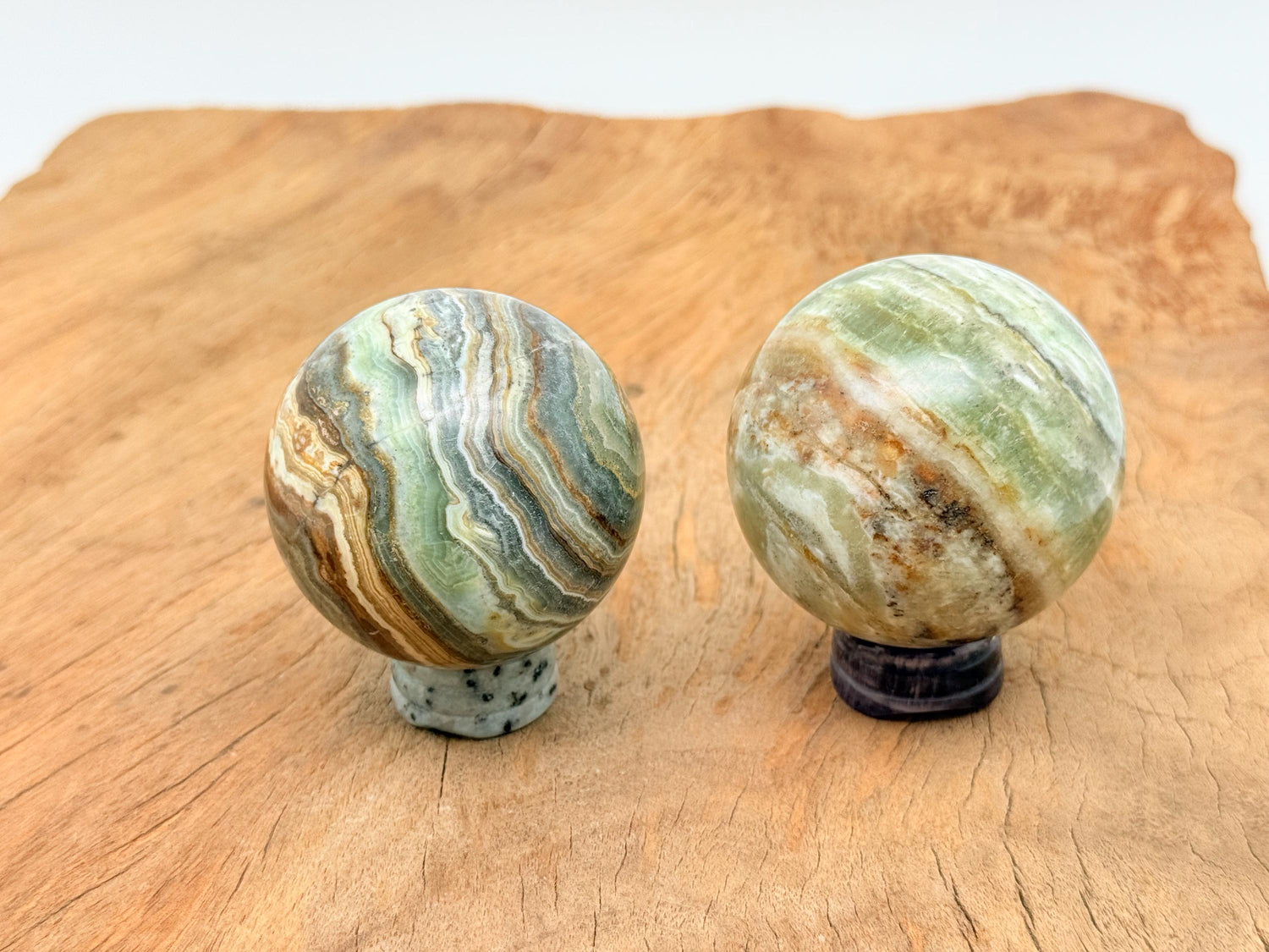 Caribbean Green Calcite sphere gemstone, 50-60mm crystal ball, vibrant green mineral with smooth polished surface.