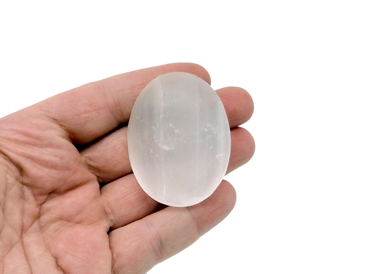Selenite palm gemstone spa stone, 50mm, smooth and translucent white crystal from GemstoneGO for relaxation and massage.