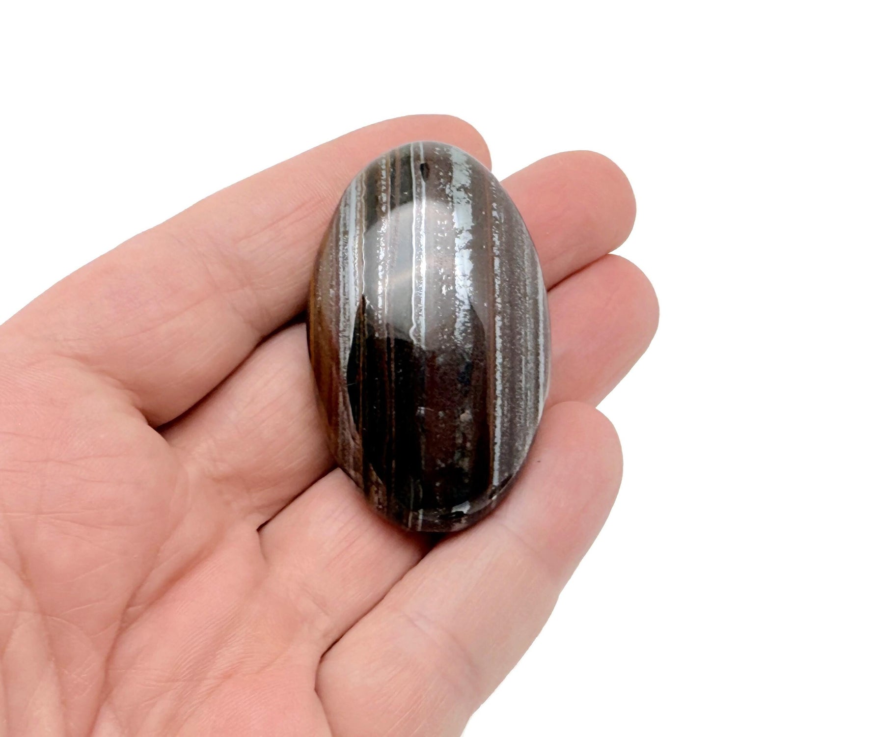 Tiger Iron palm gemstone spa stone, 50-60mm, with polished surface and natural banded patterns, by GemstoneGO.