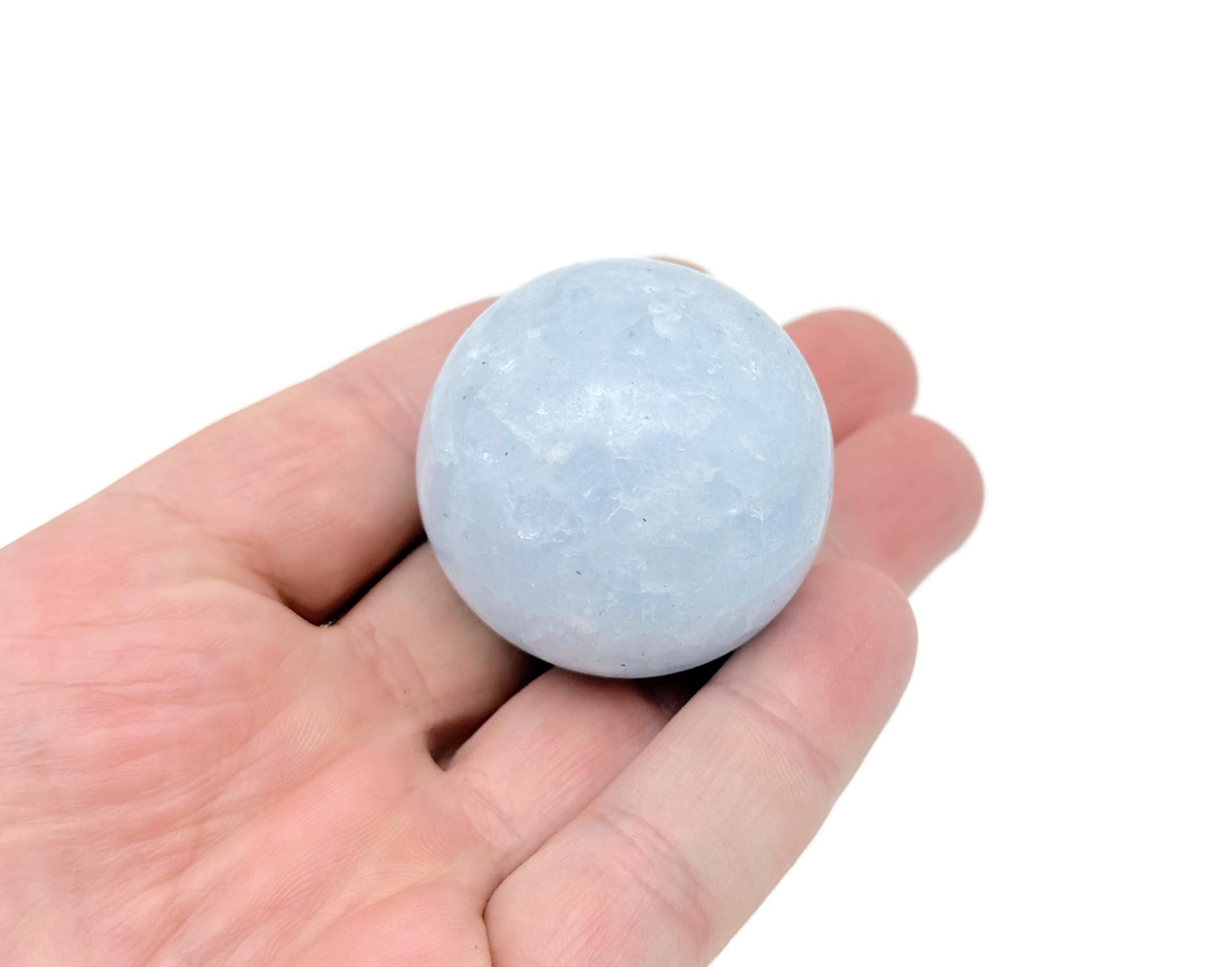 Blue Calcite sphere gemstone from GemstoneGO, 40-50mm crystal ball with smooth, polished surface and vibrant blue color.