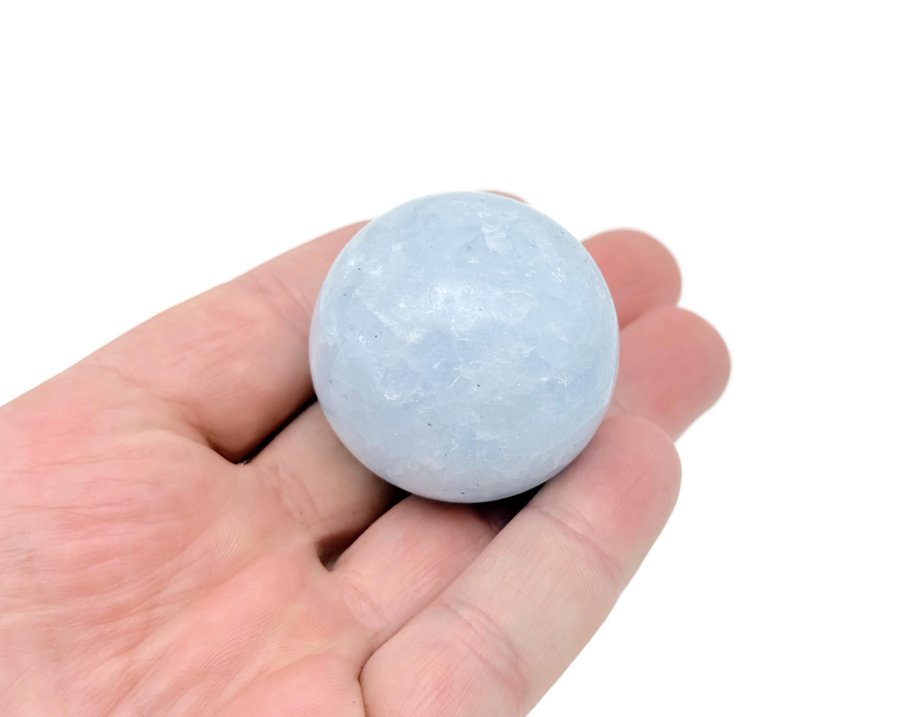 Blue Calcite sphere gemstone from GemstoneGO, 40-50mm crystal ball with smooth, polished surface and vibrant blue color.