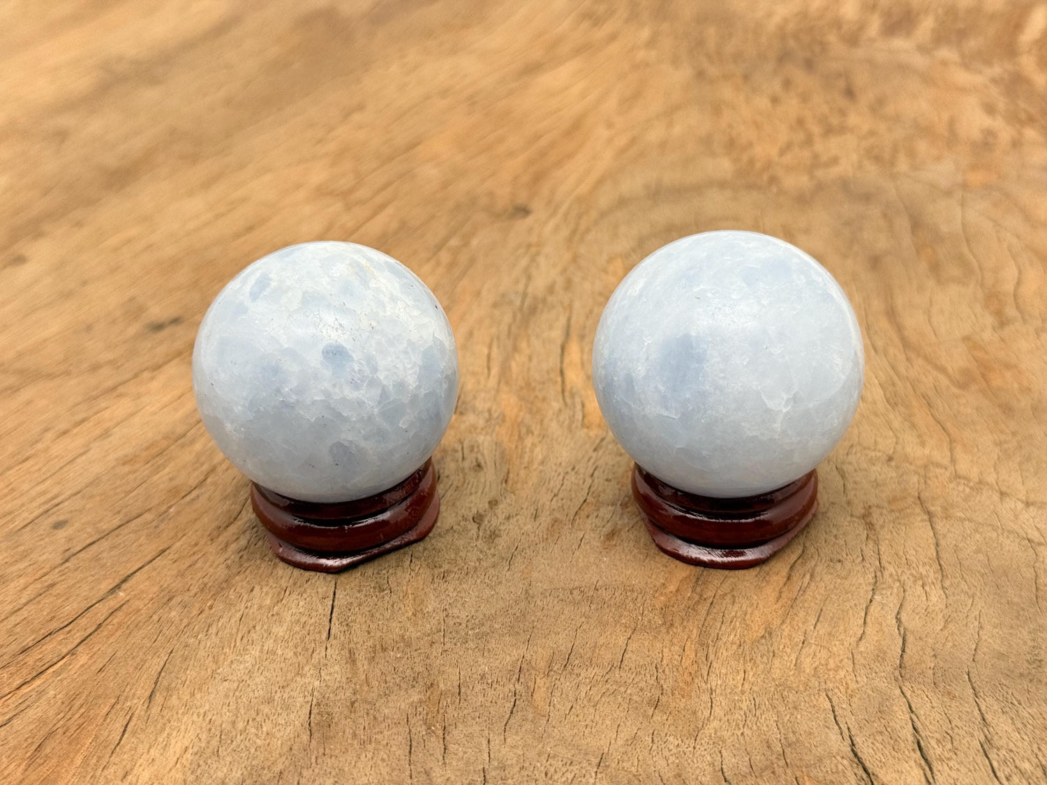 Blue calcite sphere gemstone from GemstoneGO, 40-50mm crystal ball with smooth polished surface and vibrant blue color.