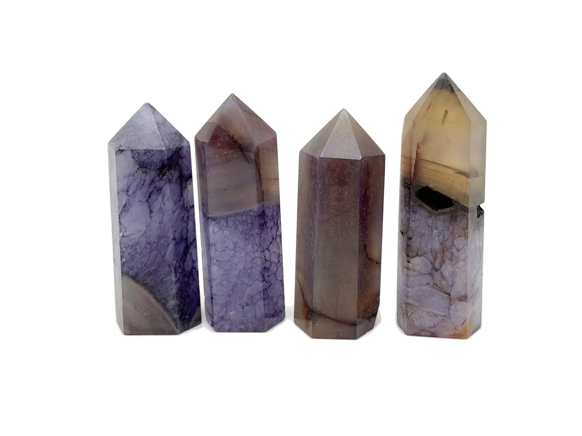 Purple Agate obelisk tower crystal from GemstoneGO, featuring a polished purple gemstone with natural banding and pointed top.