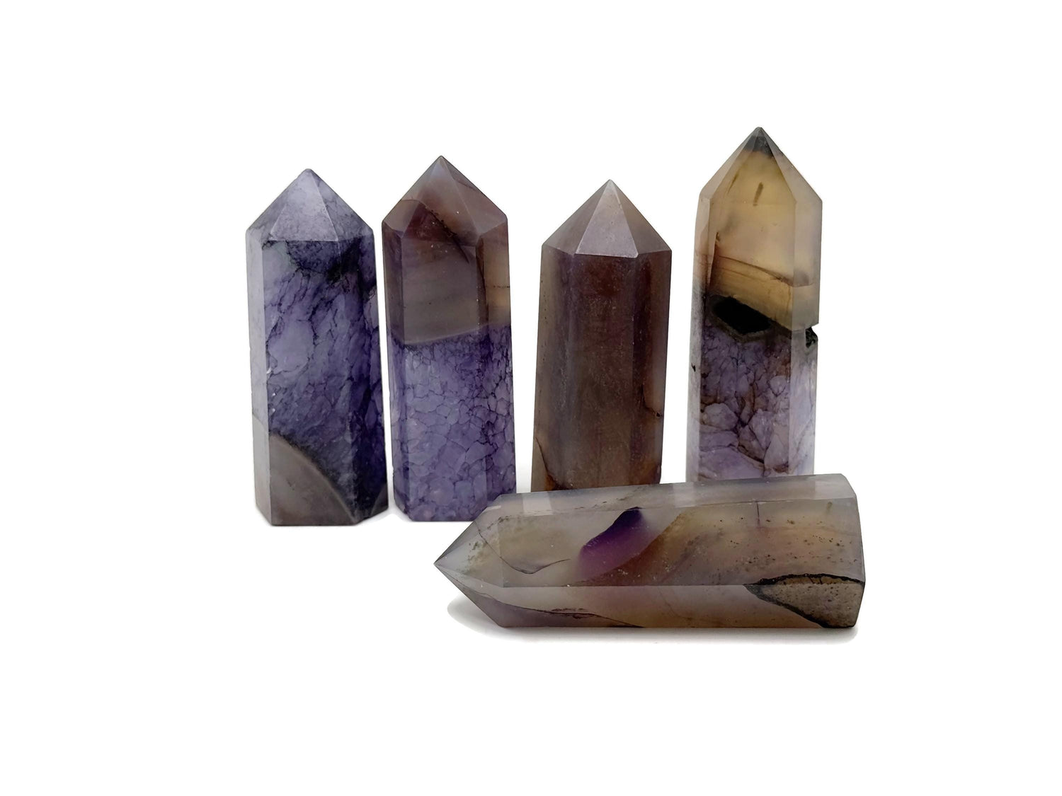 Purple Agate obelisk tower crystal from GemstoneGO, showcasing a polished purple gemstone with natural banding and pointed shape.