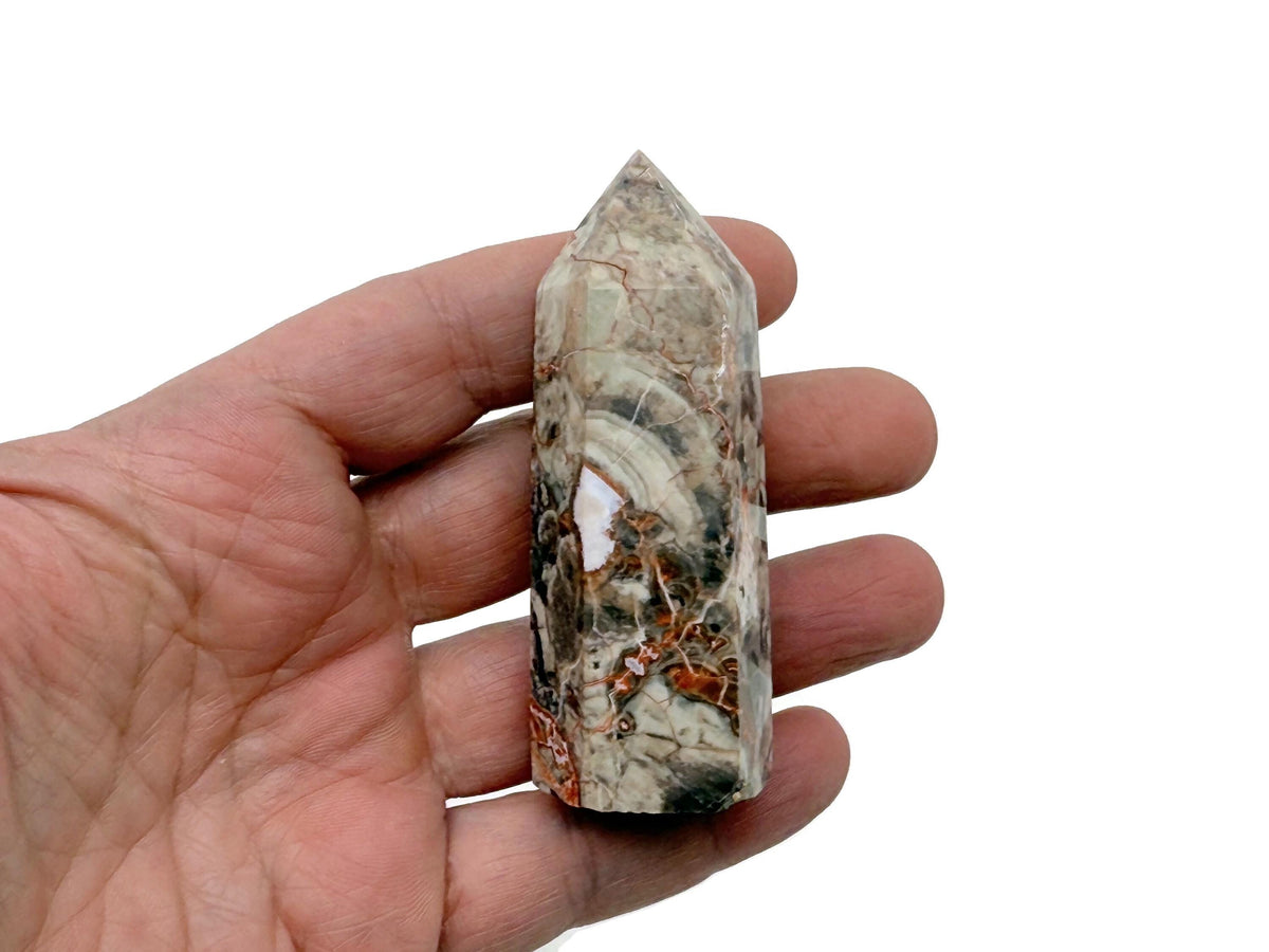 Leopard skin jasper obelisk tower crystal from GemstoneGO displaying natural patterns and warm earthy tones.