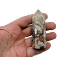 Leopard skin jasper obelisk tower crystal from GemstoneGO displaying natural patterns and warm earthy tones.