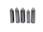 GemstoneGO Terahertz Obelisk Tower Crystal with polished black and gold accents, showcasing intricate gemstone details and smooth surface.