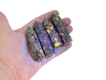 Yooperlite obelisk tower crystal with fluorescent sodalite stone, showcasing vibrant glow under UV light, from GemstoneGO.
