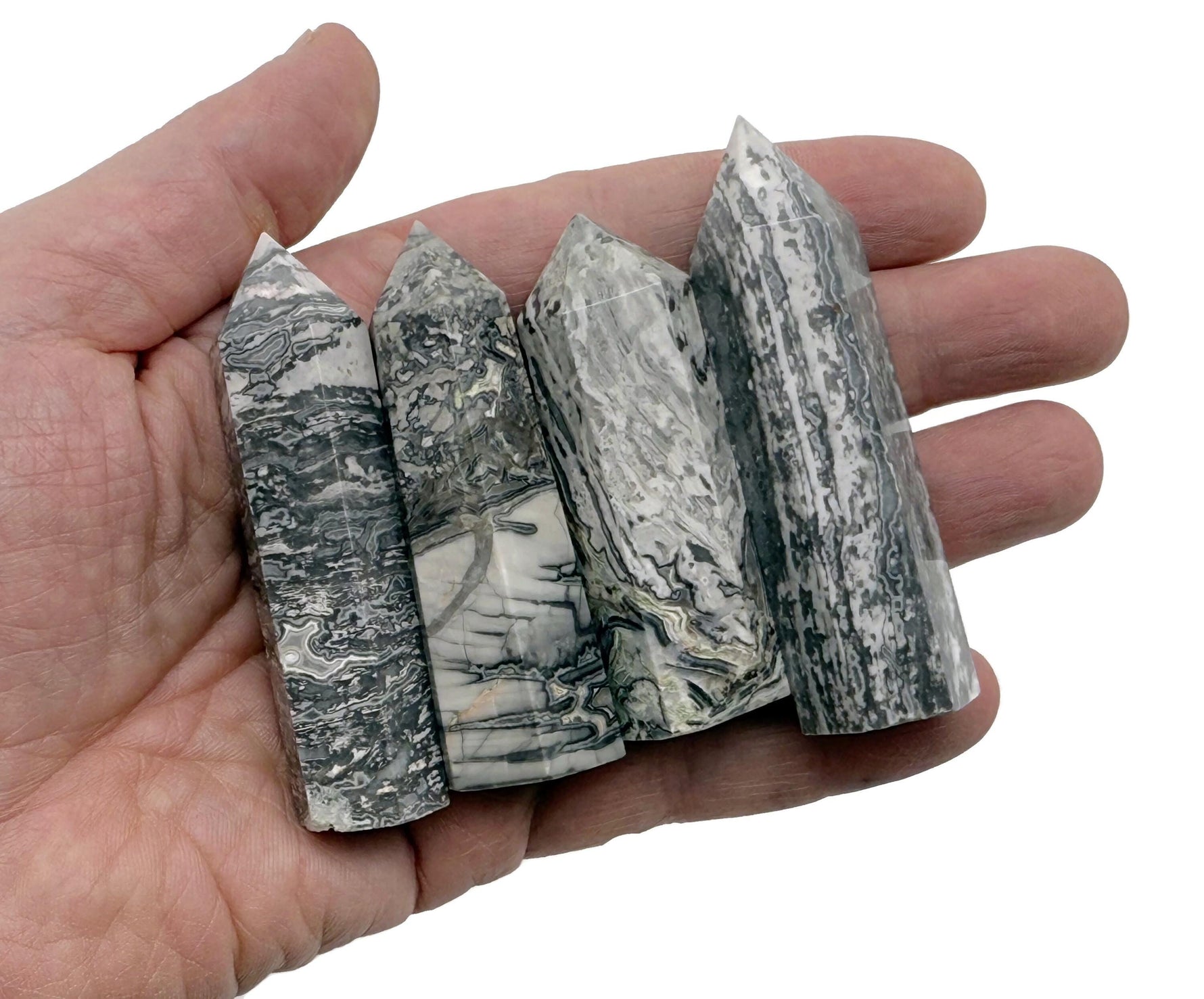Picasso Jasper obelisk tower crystal from GemstoneGO showing a polished, natural stone with unique blue, brown, and cream patterns.
