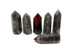 African Bloodstone obelisk tower crystal from GemstoneGO, showcasing a dark green stone with reddish bloodstone inclusions.