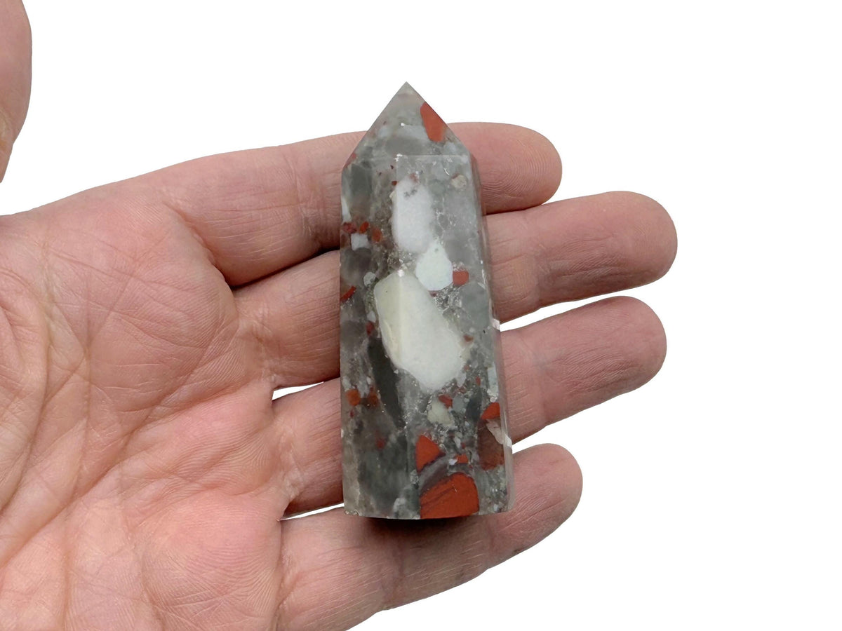 African Bloodstone obelisk tower crystal from GemstoneGO, showcasing a green and red gemstone on a natural stone base.