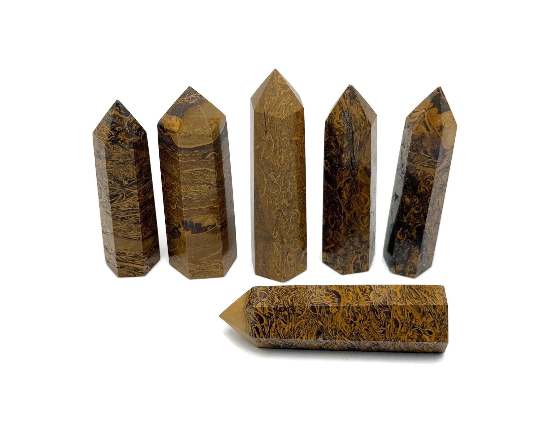 Calligraphy Jasper obelisk tower crystal from GemstoneGO, showcasing a polished, natural stone with rich earthy tones and intricate patterns.