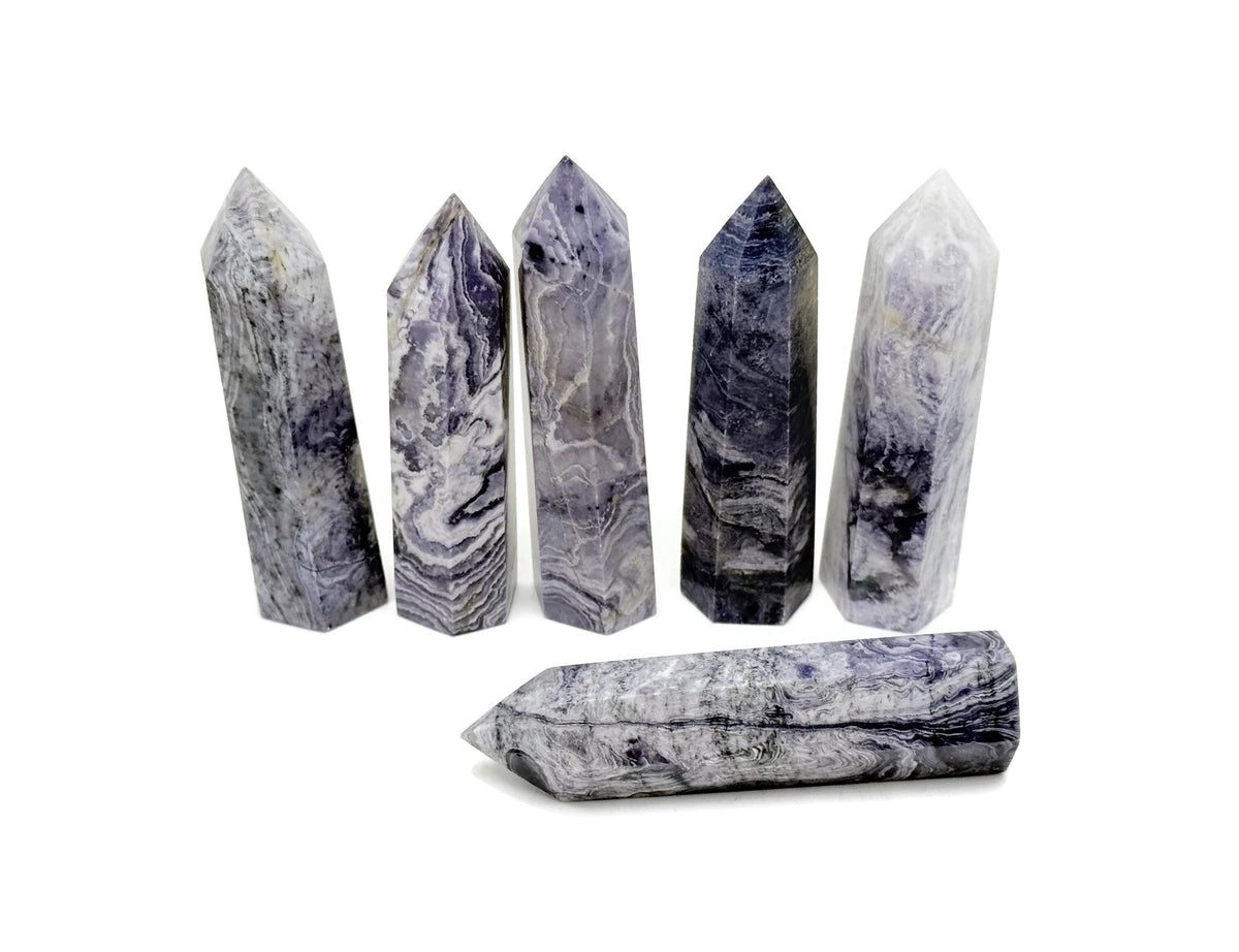 Purple Lavender Lace Agate obelisk tower crystal from GemstoneGO, showcasing a polished purple and lavender stone with intricate natural patterns.
