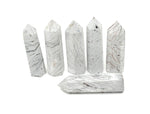 Mexican White Agate obelisk tower crystal by GemstoneGO, showcasing smooth polished surface and natural white veining.